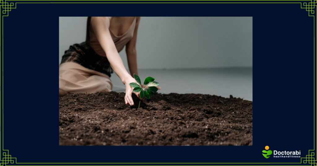 Woman-touching-seedlings